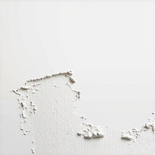 Drywall Patch and Finishing Close-up of drywall repair process with patch and joint compound